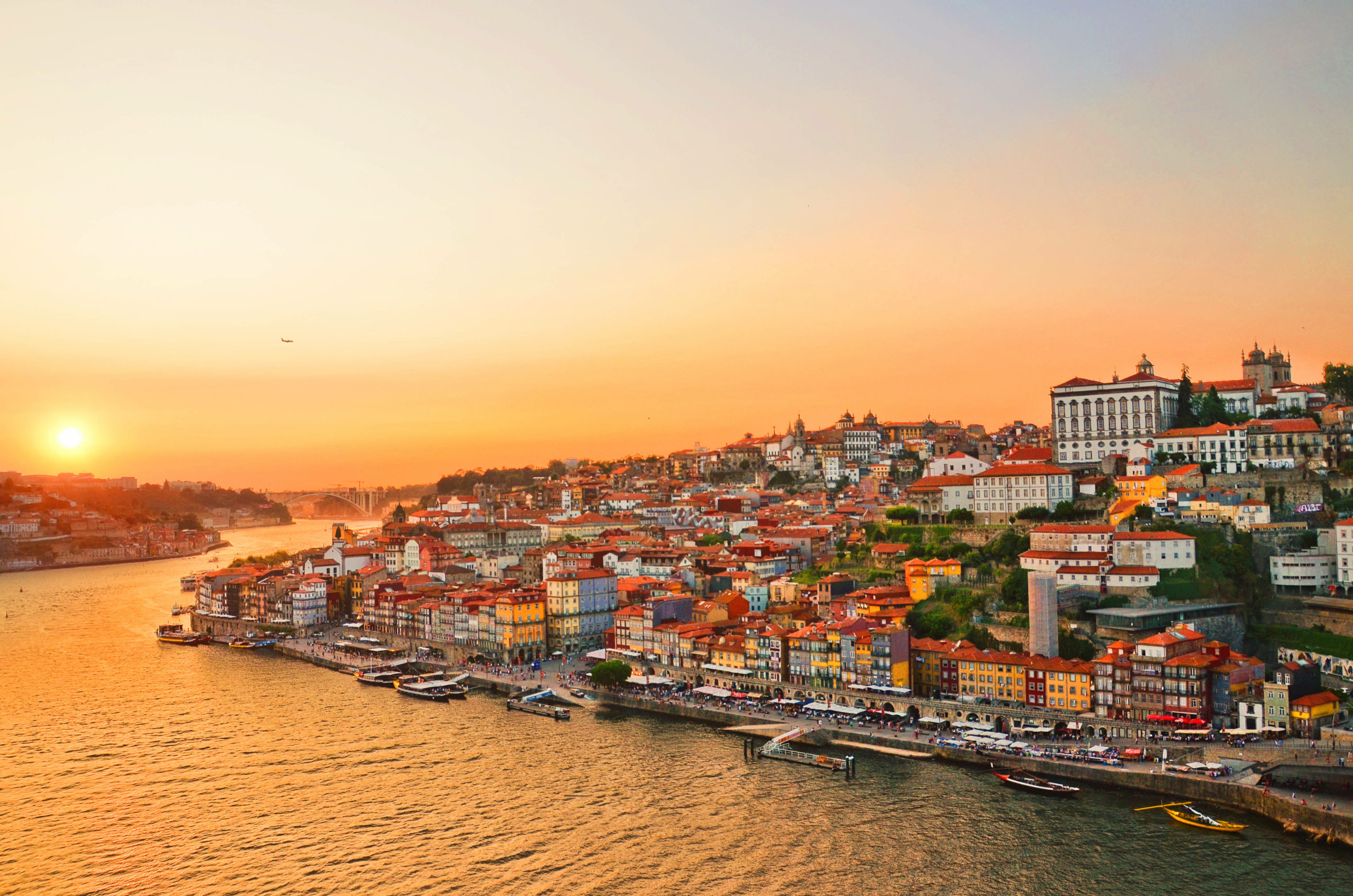 Magnificent sunset over the Porto city center and the Douro river, Portugal. Dom Luis I Bridge is a popular tourist spot as it offers such a beautiful view over the area.