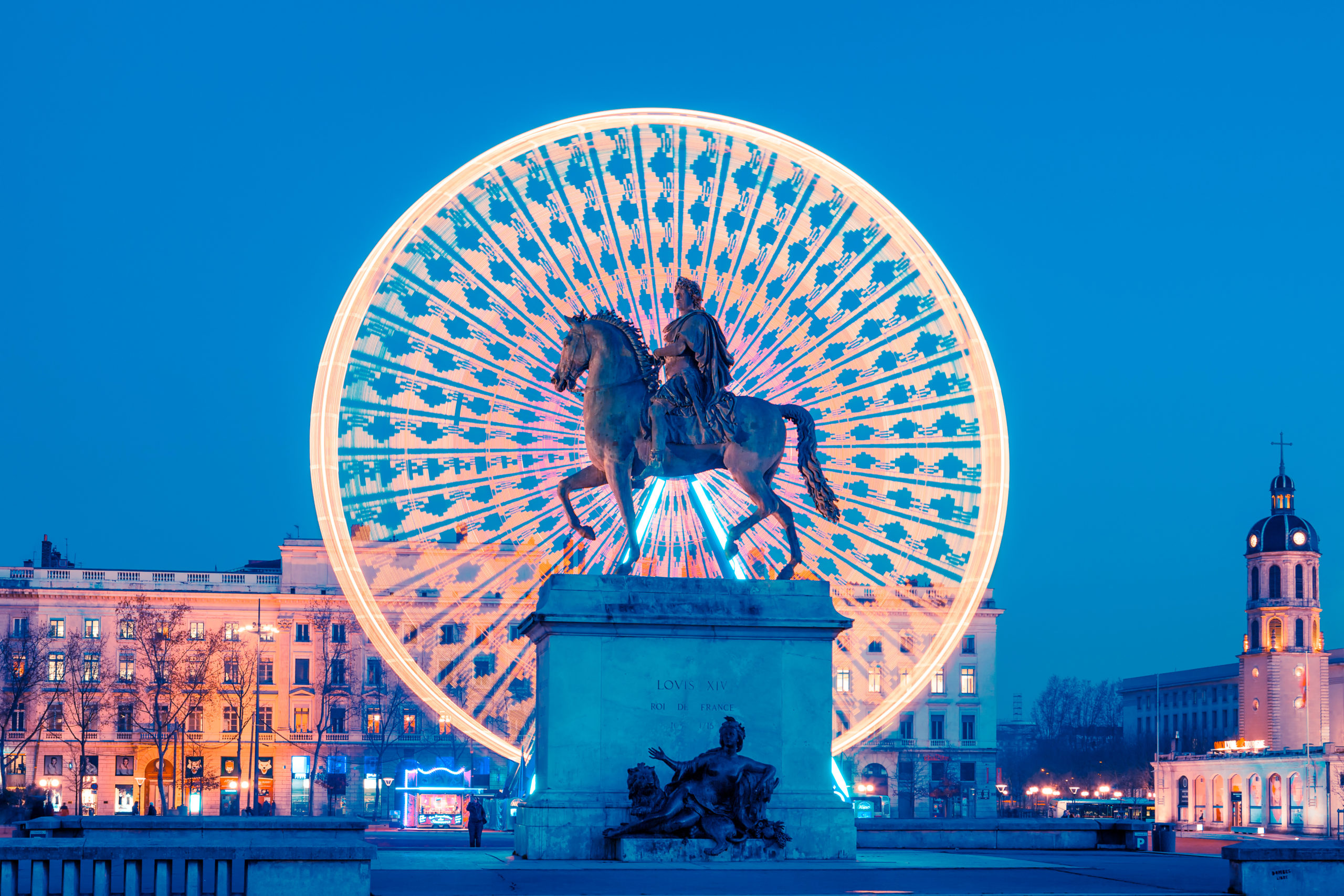 Place Bellecour statue of King Louis XIV by night, Lyon France