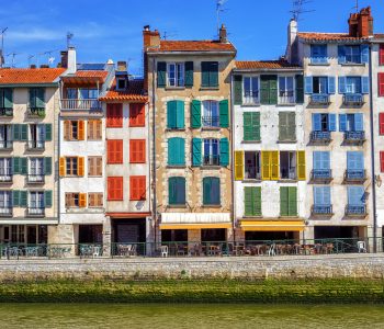 Traditional facades with coloful windows in Bayonne, Basque Country, France