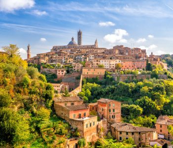 Downtown Siena skyline in Italy with blue sky