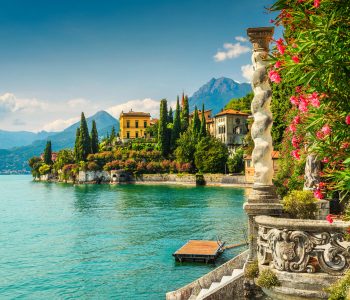 Famous luxury villa Monastero, stunning botanical garden decorated with mediterranean oleander flowers, lake Como, Varenna, Lombardy region, Italy, Europe