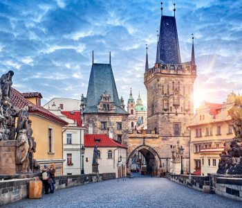 Sunrise on Charles bridge in Prague Czech Republic picturesque landscape morning old Europe with vintage architecture and historical landmark.