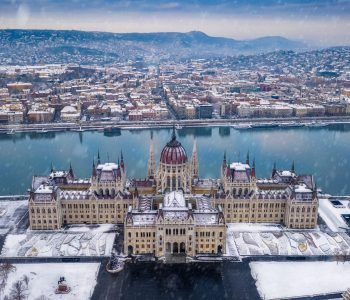 Budapest, Hungary - Aerial view of the Parliament of Hungary at winter time with snowing