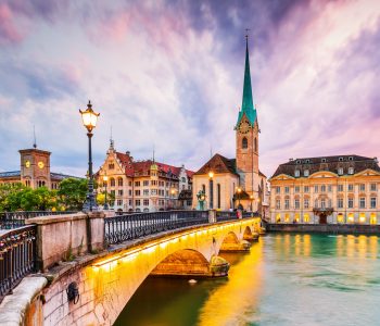 Zurich, Switzerland. View of the historic city center with famous Fraumunster Church, on the Limmat river.