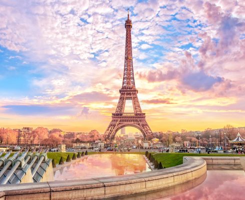 Eiffel Tower at sunset in Paris, France. Romantic travel background