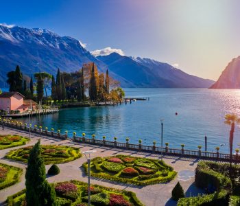 Beautiful and colorful autumn in Riva del Garda,Panorama of the gorgeous Garda lake surrounded by mountains in the autumn time