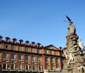 The monument dedicated to the Frejus Tunnel was built by Luigi Belli in 1879. On the pyramid of stones, titan bodies in light marble and the winged genius of Science.