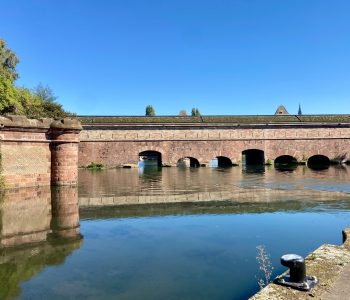 reflection of the old vauban dam in the river